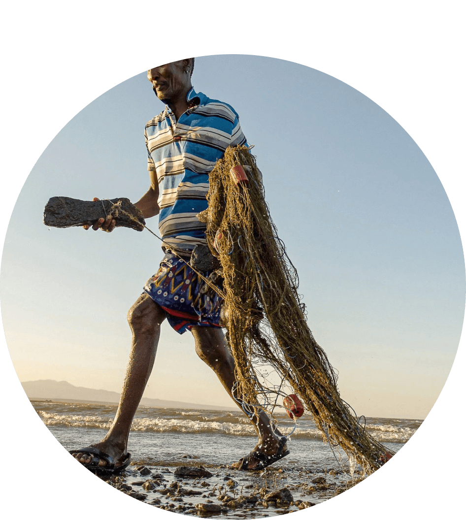 Male fisherman hauling fishing nets.
